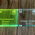 Sample squares of 1/4" cast acrylic in two colors; Fluorescent Green and Glass Green.